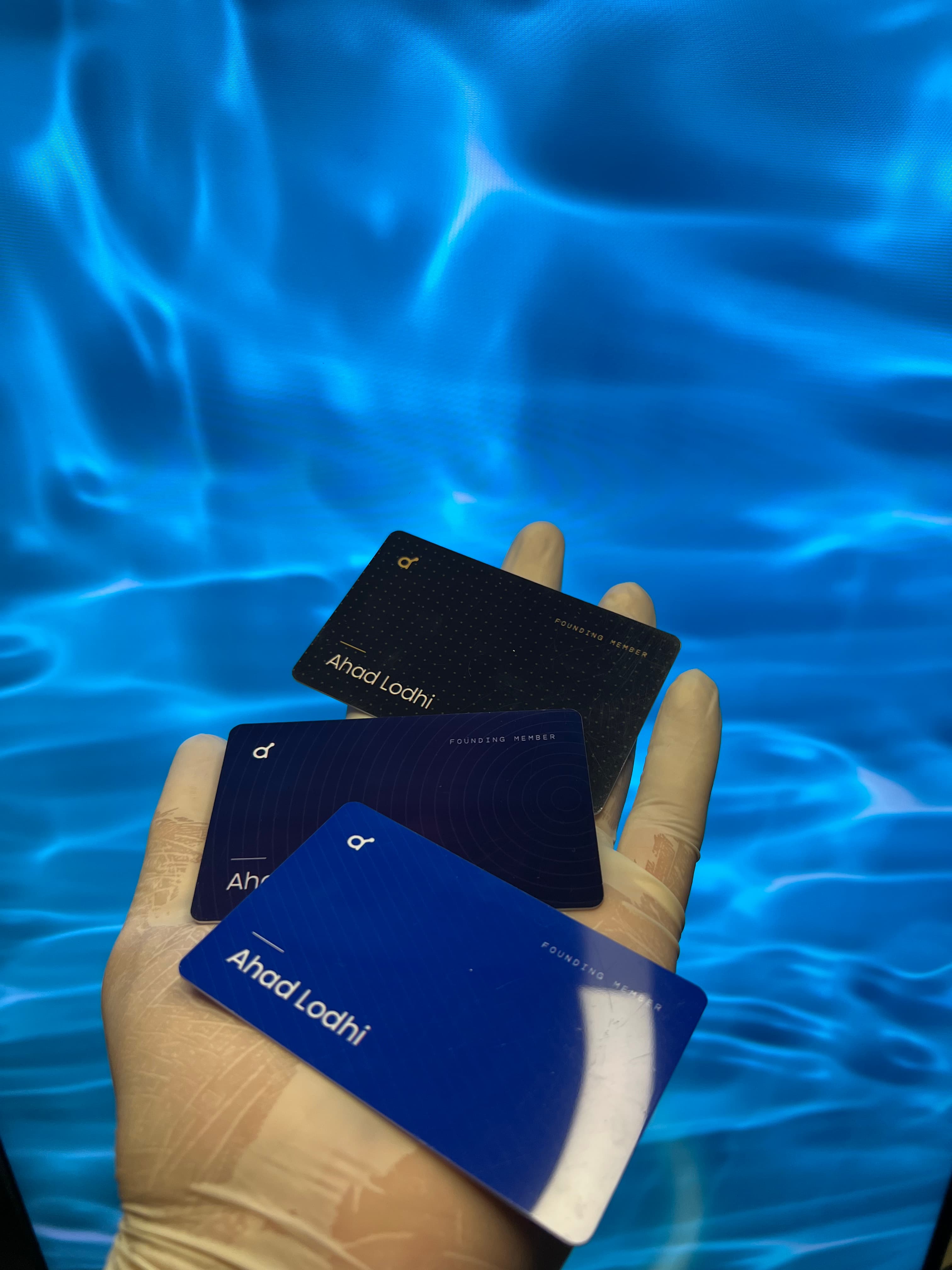 A physical Atapata NFC business card held in a hand.